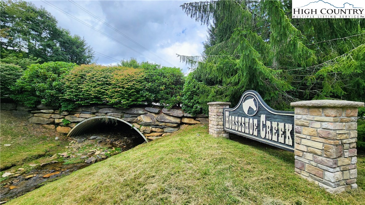 Lot 1 Horseshoe Creek Road Banner Elk, NC 28604 - Photo 19 of 20 a view of a wooden chairs and iron fence