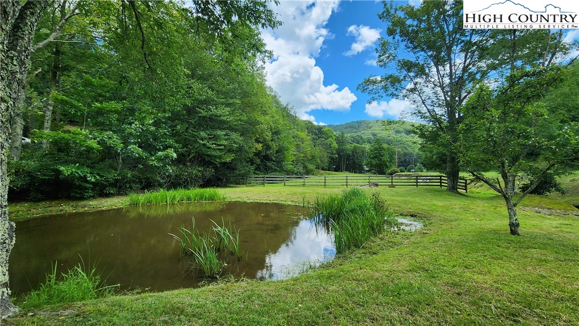 Lot 1 Horseshoe Creek Road Banner Elk, NC 28604 - Photo 4 of 20 a view of a golf course with a lake