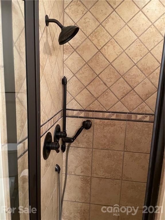 6770 Faith Road Salisbury, NC 28146 - Photo 22 of 26 a bathroom with a shower