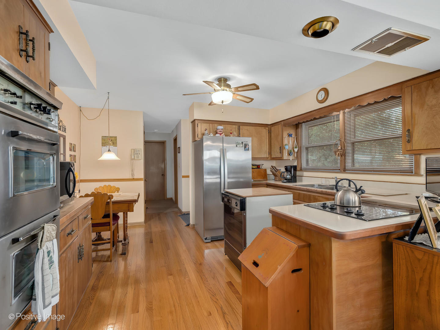 516 Eldon Place Downers Grove, IL 60516 - Photo 11 of 18 a kitchen with a sink appliances and cabinets