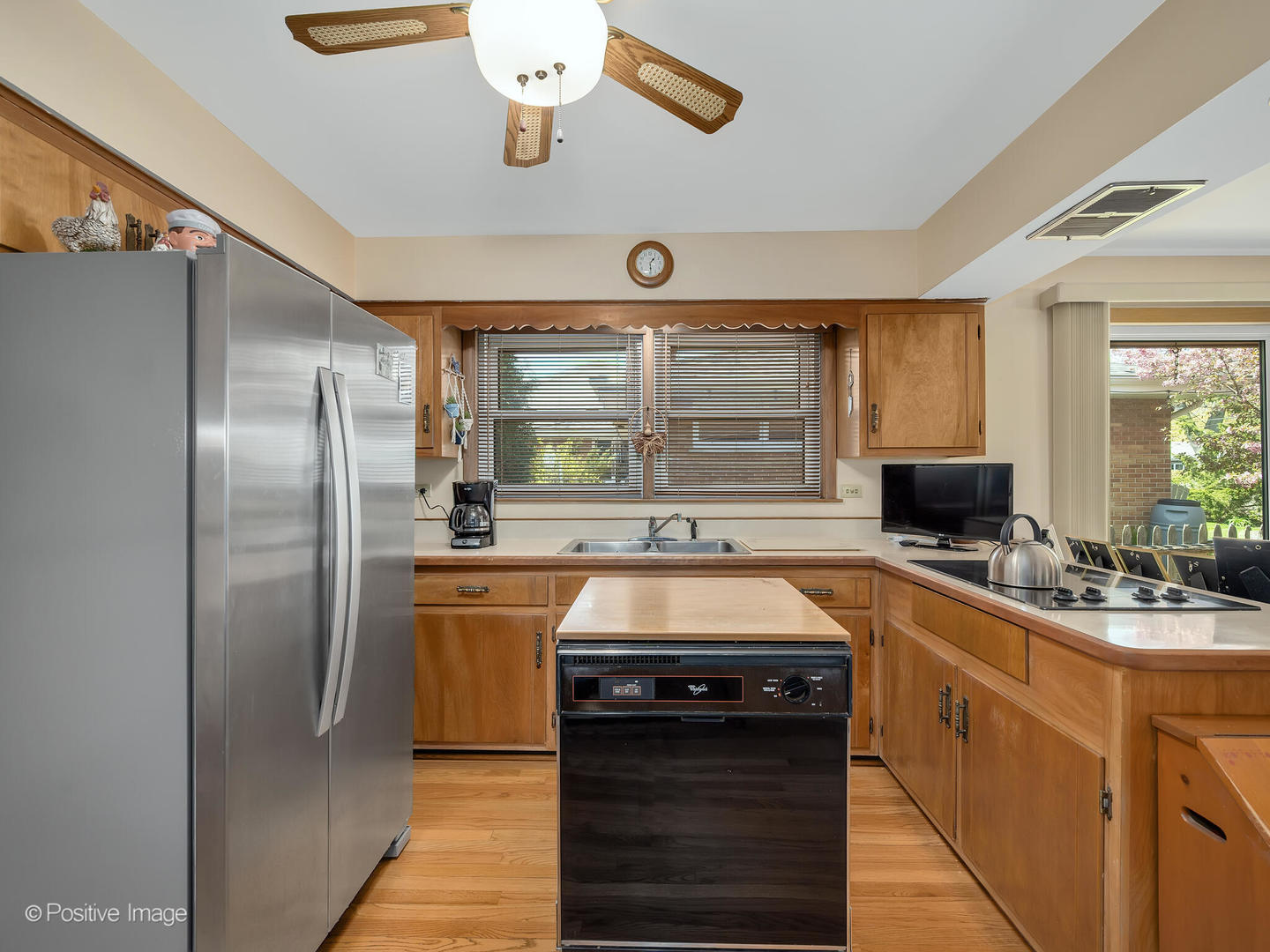 516 Eldon Place Downers Grove, IL 60516 - Photo 12 of 18 a kitchen with stainless steel appliances granite countertop a stove and refrigerator