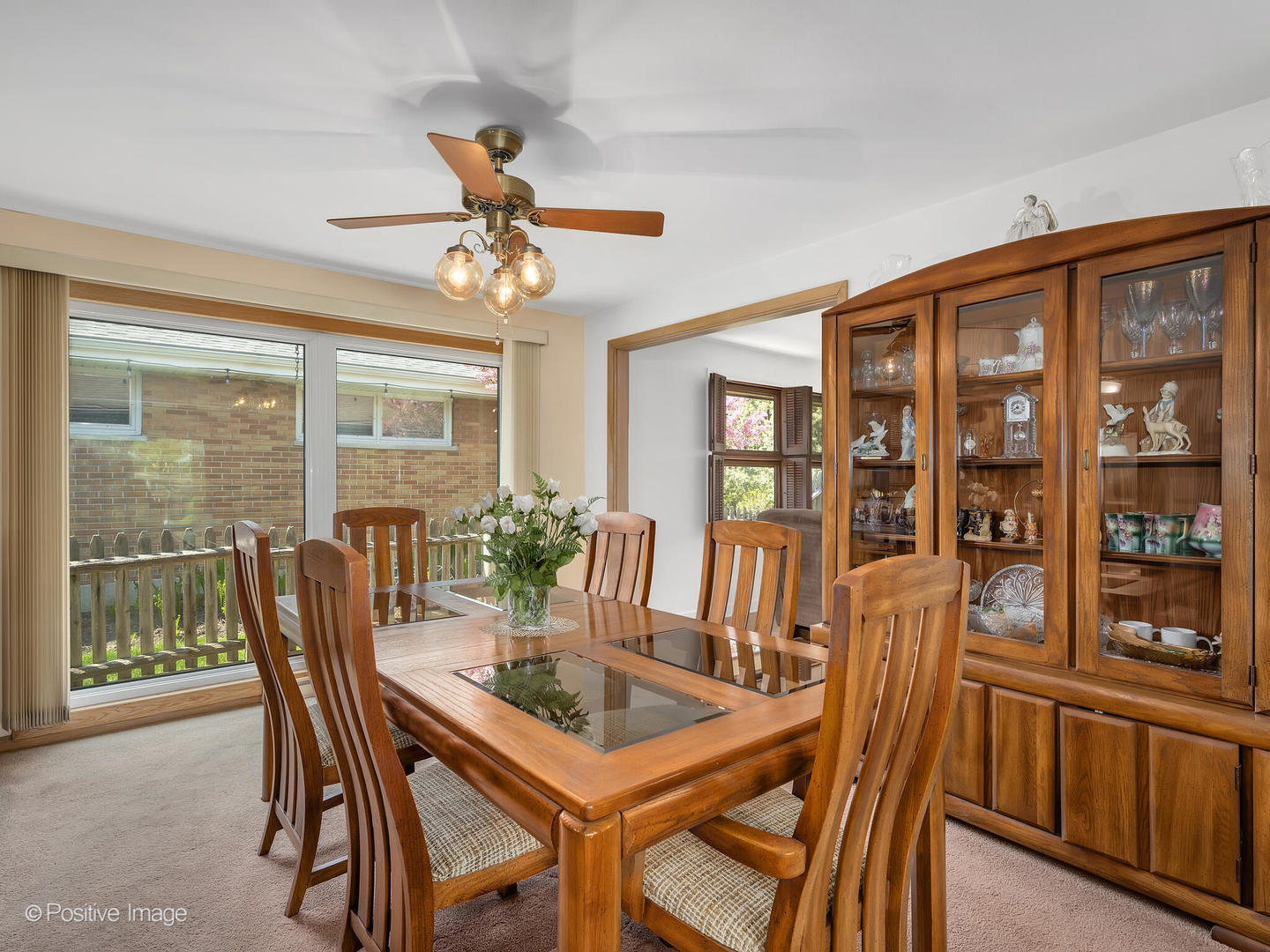 516 Eldon Place Downers Grove, IL 60516 - Photo 13 of 18 a dining room with furniture a chandelier and wooden floor