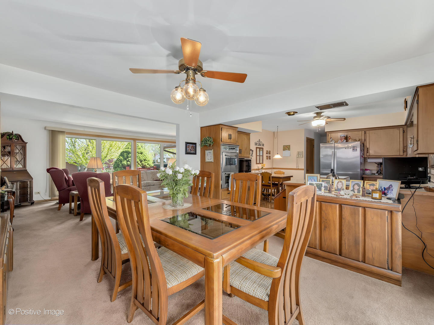 516 Eldon Place Downers Grove, IL 60516 - Photo 7 of 18 a dining room with furniture and a large window