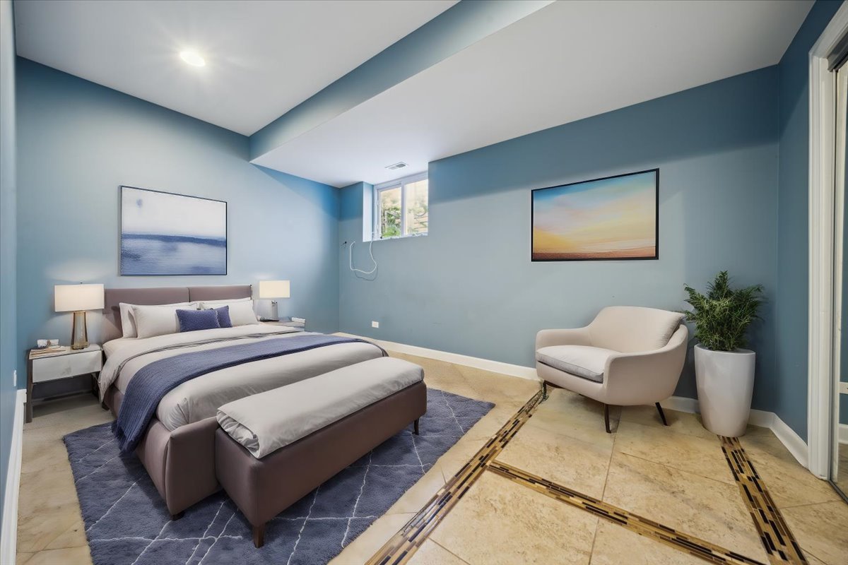 2929 North Rutherford Avenue Chicago, IL 60634 - Photo 12 of 26 a spacious bedroom with a bed and a couch