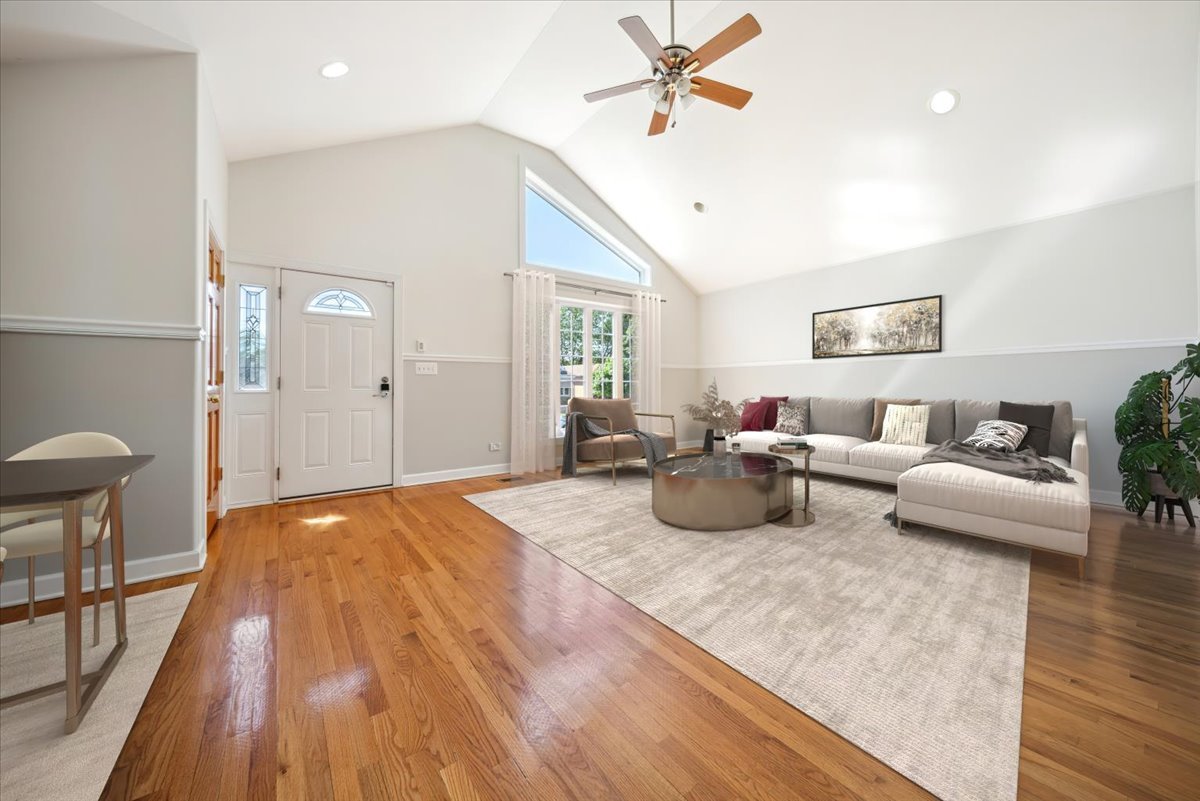 2929 North Rutherford Avenue Chicago, IL 60634 - Photo 2 of 26 a bedroom with furniture and a wooden floor