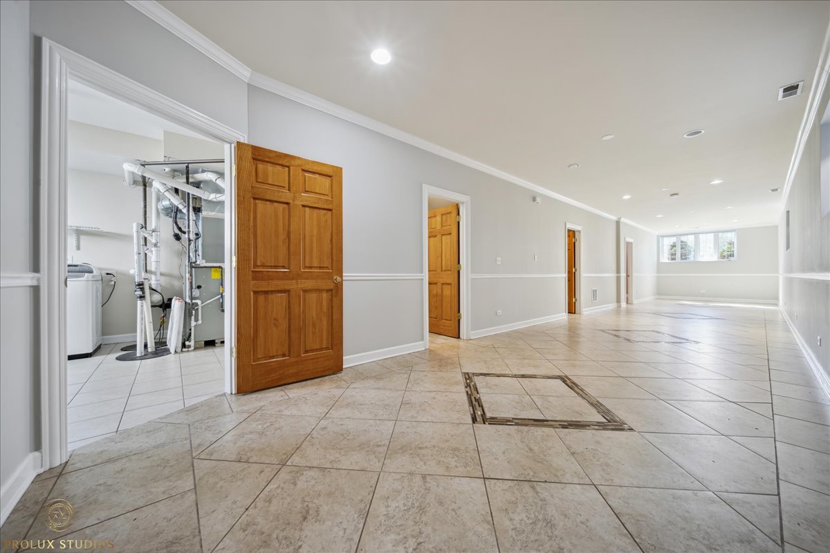 2929 North Rutherford Avenue Chicago, IL 60634 - Photo 23 of 26 a view of a hallway with wooden shelves