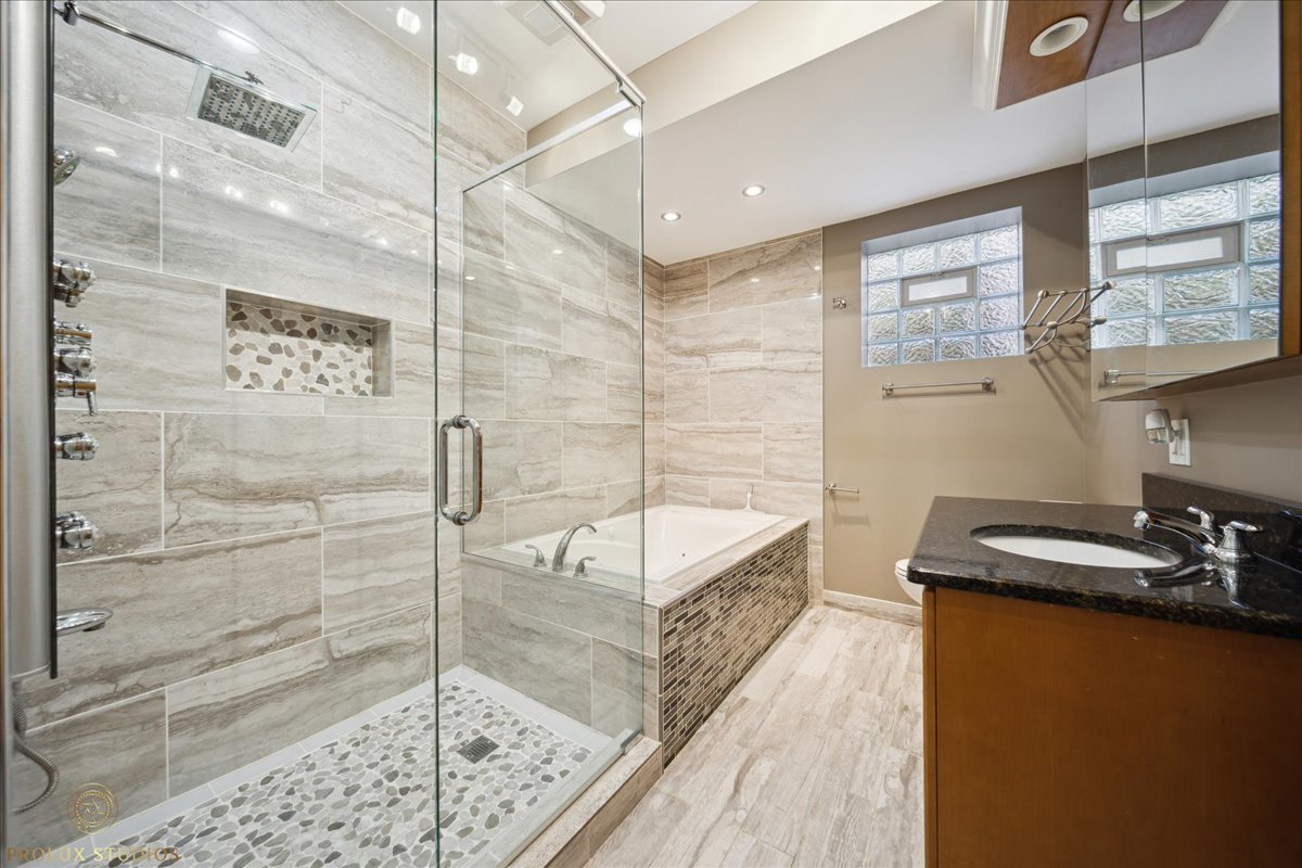 2929 North Rutherford Avenue Chicago, IL 60634 - Photo 25 of 26 a bathroom with a sink and a shower