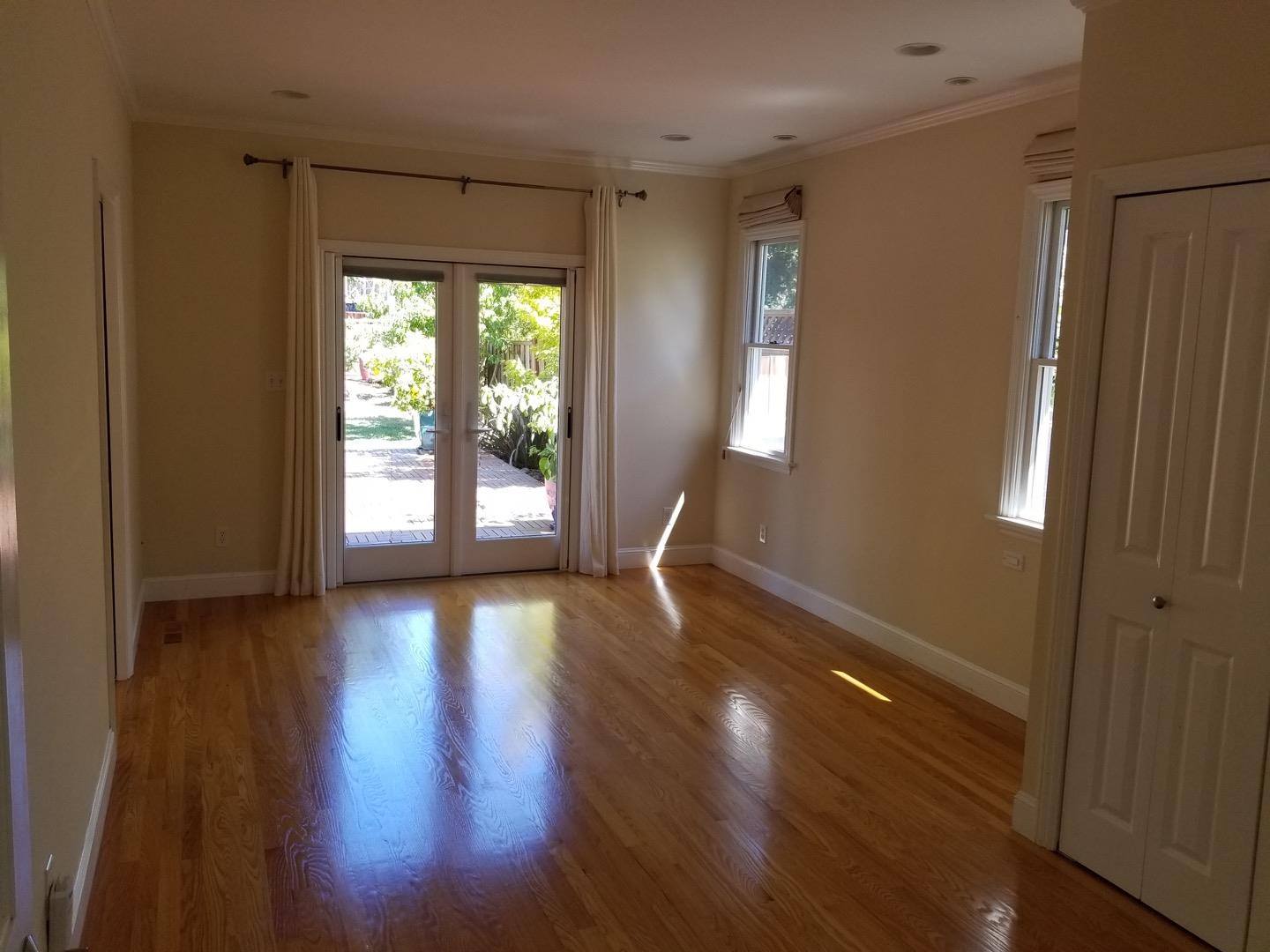 537 View Street Mountain View, CA 94041 - Photo 3 of 9 a view of an empty room with wooden floor and a window