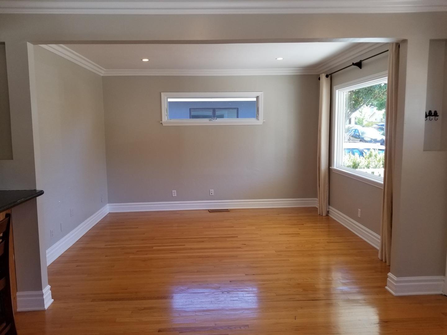 537 View Street Mountain View, CA 94041 - Photo 4 of 9 a view of an empty room with wooden floor and a window
