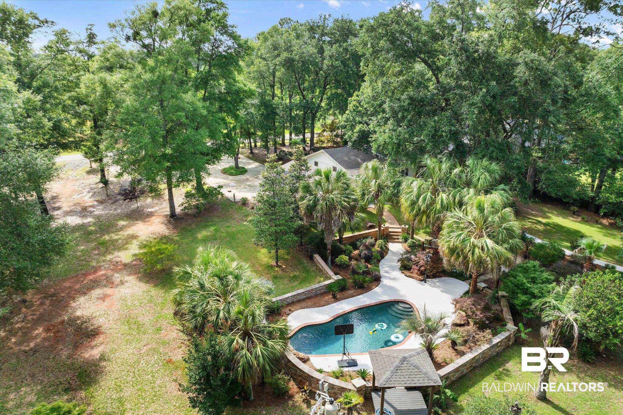 3715 Latigo Road Mobile, AL 36695 - Photo 28 of 39 Aerial view of property's location featuring a tree filled landscape and a pool