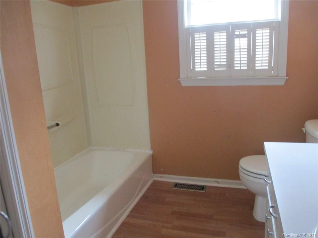 2312 Sunshine Road Lancaster, SC 29720 - Photo 10 of 16 a bathroom with a bathtub and a toilet