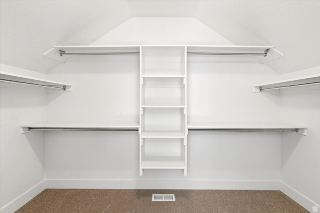 857 225 South Springville, UT 84663 - Photo 12 of 23 Spacious closet featuring white built-in shelving, multiple hanging rods, and an integrated central storage unit
