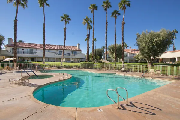 a view of a swimming pool with a patio