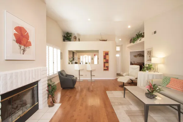 a living room with furniture and a fireplace