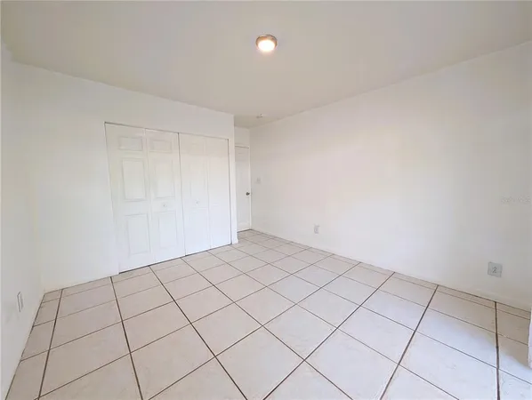 a view of an empty room and a window