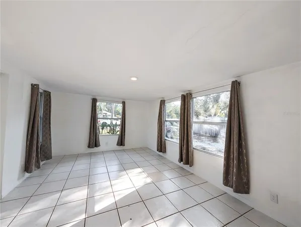 a view of an empty room and window