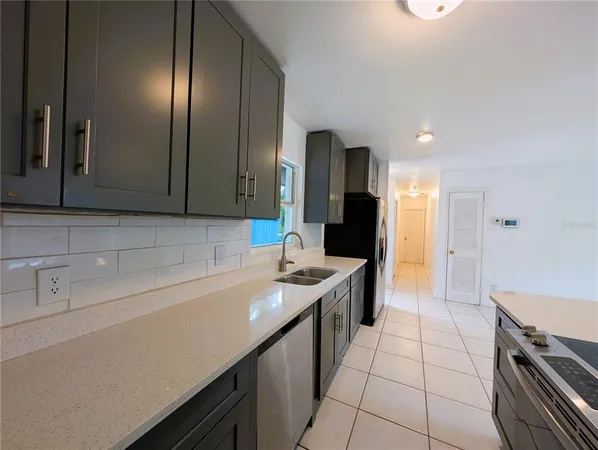 a kitchen with a sink and cabinets