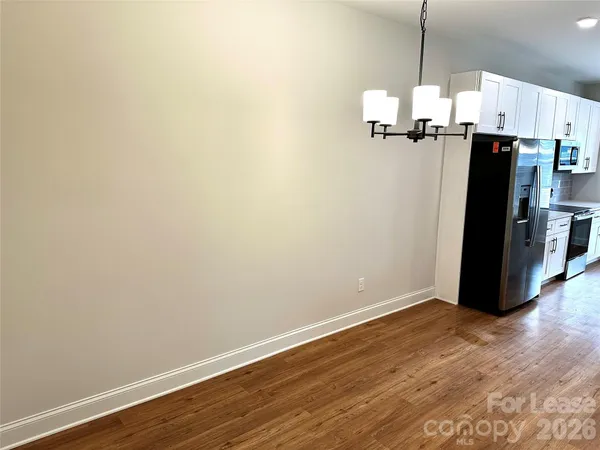 a view of a storage & utility room with wooden floor