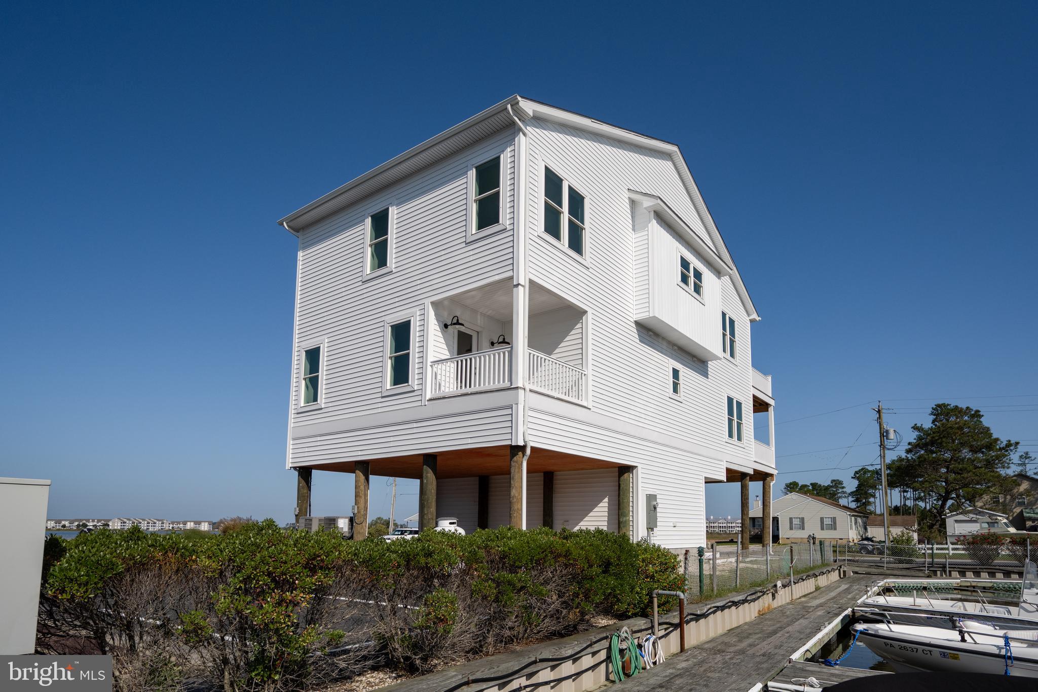 30547 Topside Court Ocean View, DE 19970 - Photo 25 of 39 a front view of a house with a yard