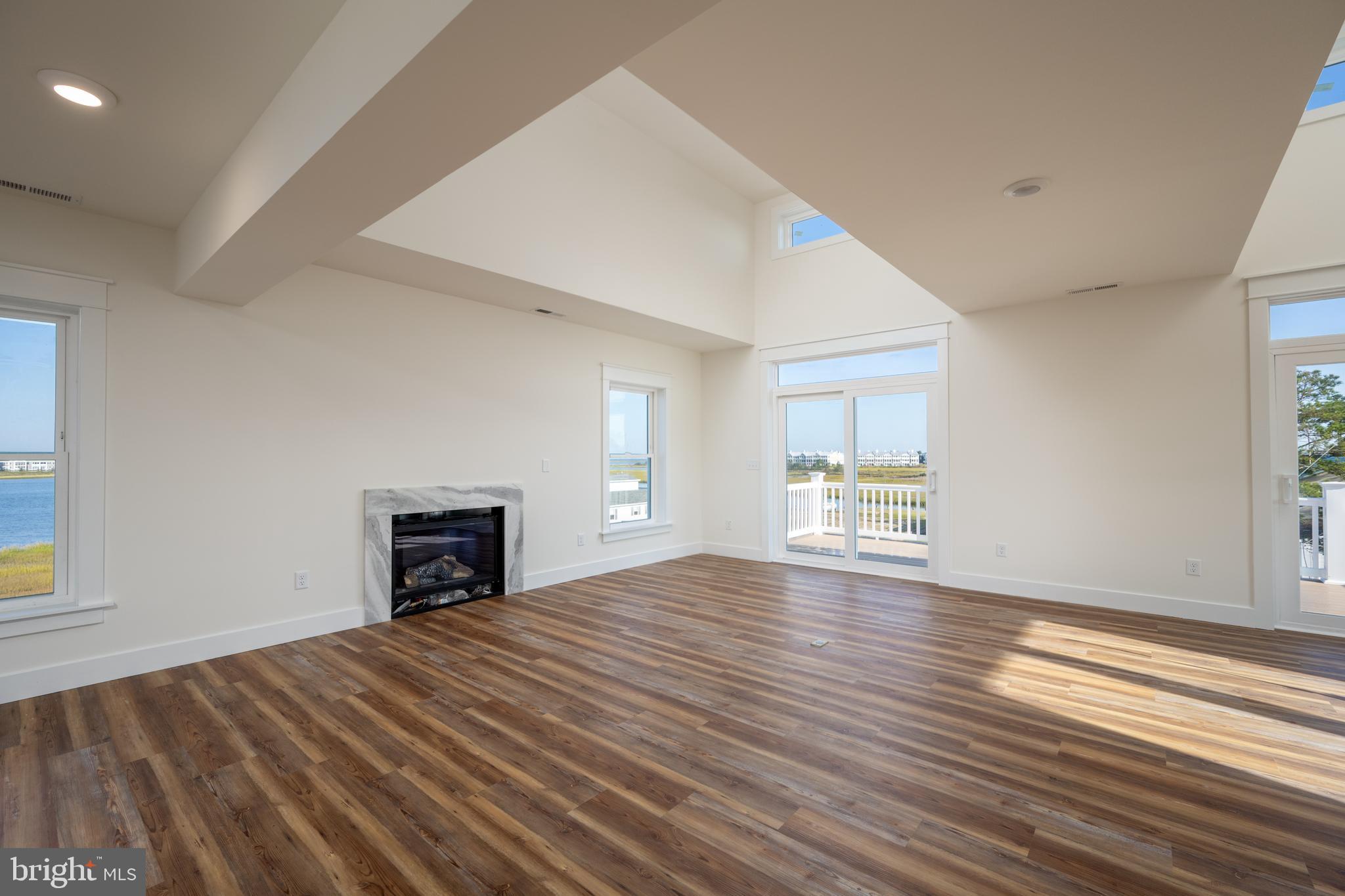 30547 Topside Court Ocean View, DE 19970 - Photo 29 of 39 a view of empty room with wooden floor and fan