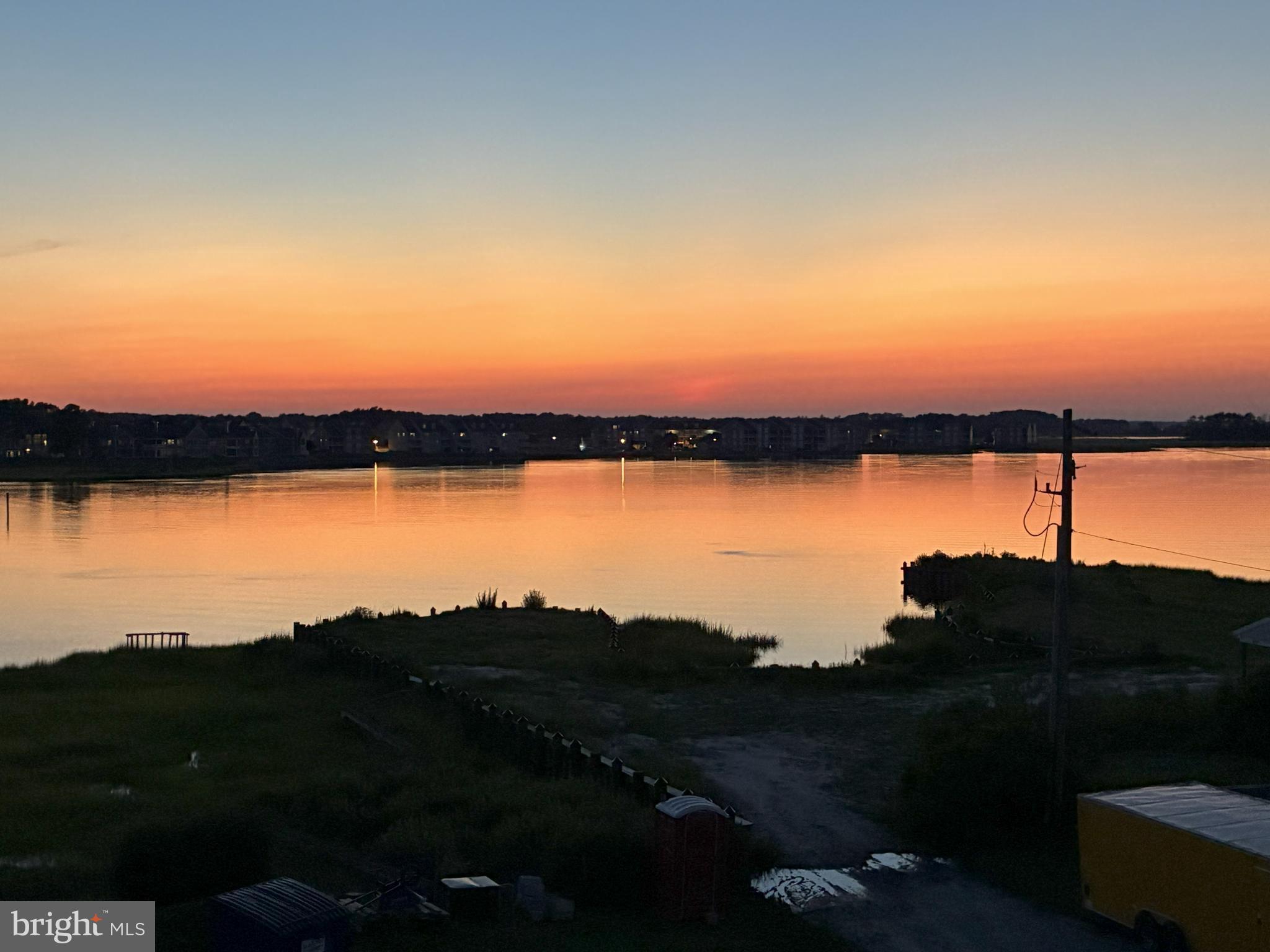30547 Topside Court Ocean View, DE 19970 - Photo 3 of 39 a view of lake with mountain in background
