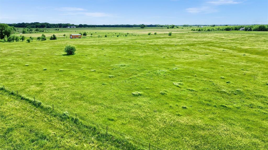 13-ac Bennett Lane Sadler, TX 76264 - Photo 5 of 6 a view of a lake with a beach