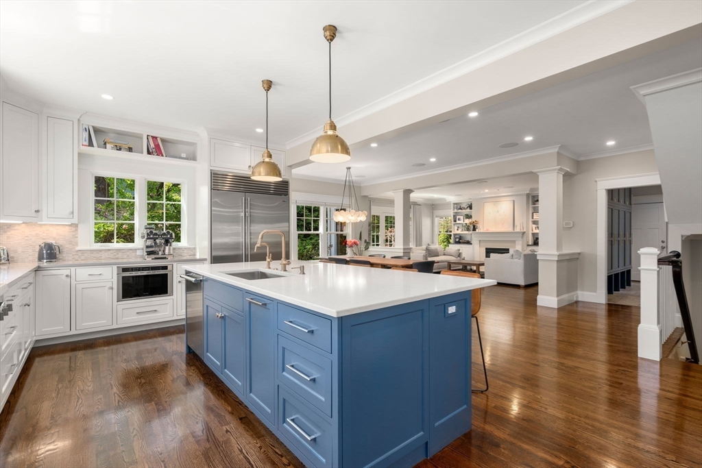 18 Avalon Road Newton, MA 02468 - Photo 11 of 37 a kitchen with stainless steel appliances granite countertop sink stove and wooden floor