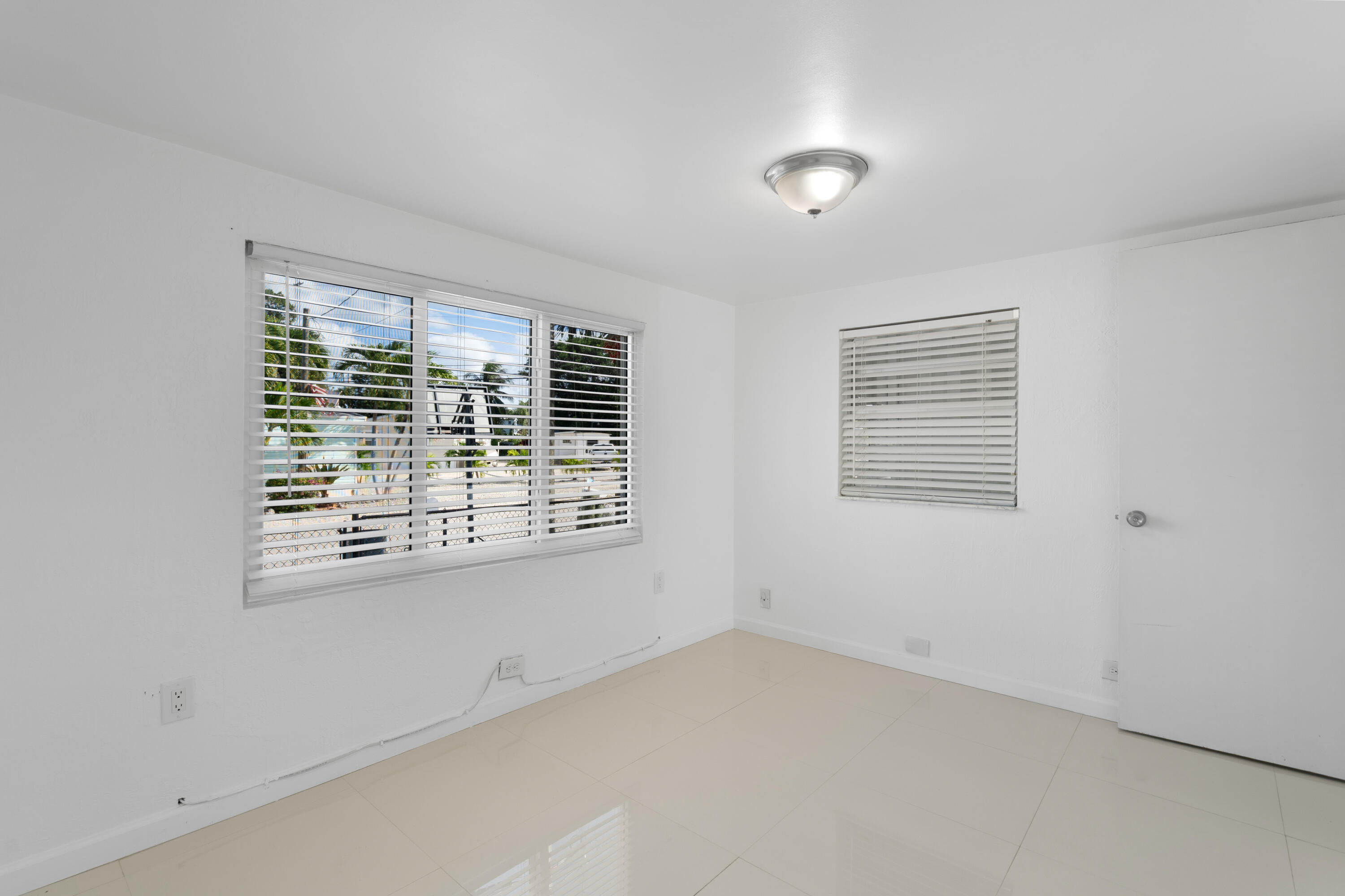 314 Windley Road Key Largo, FL 33037 - Photo 17 of 32 a view of an empty room with a window