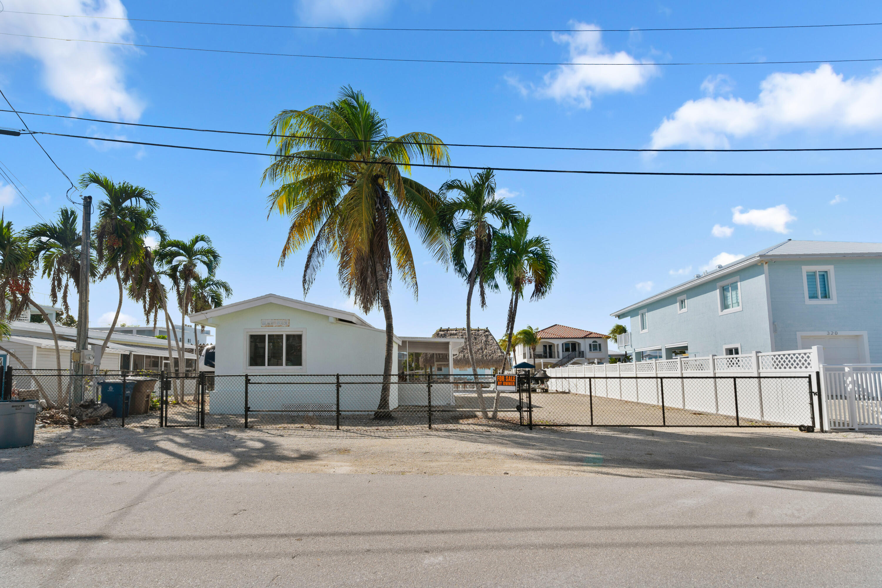 314 Windley Road Key Largo, FL 33037 - Photo 2 of 32 a view of a palm trees front of house