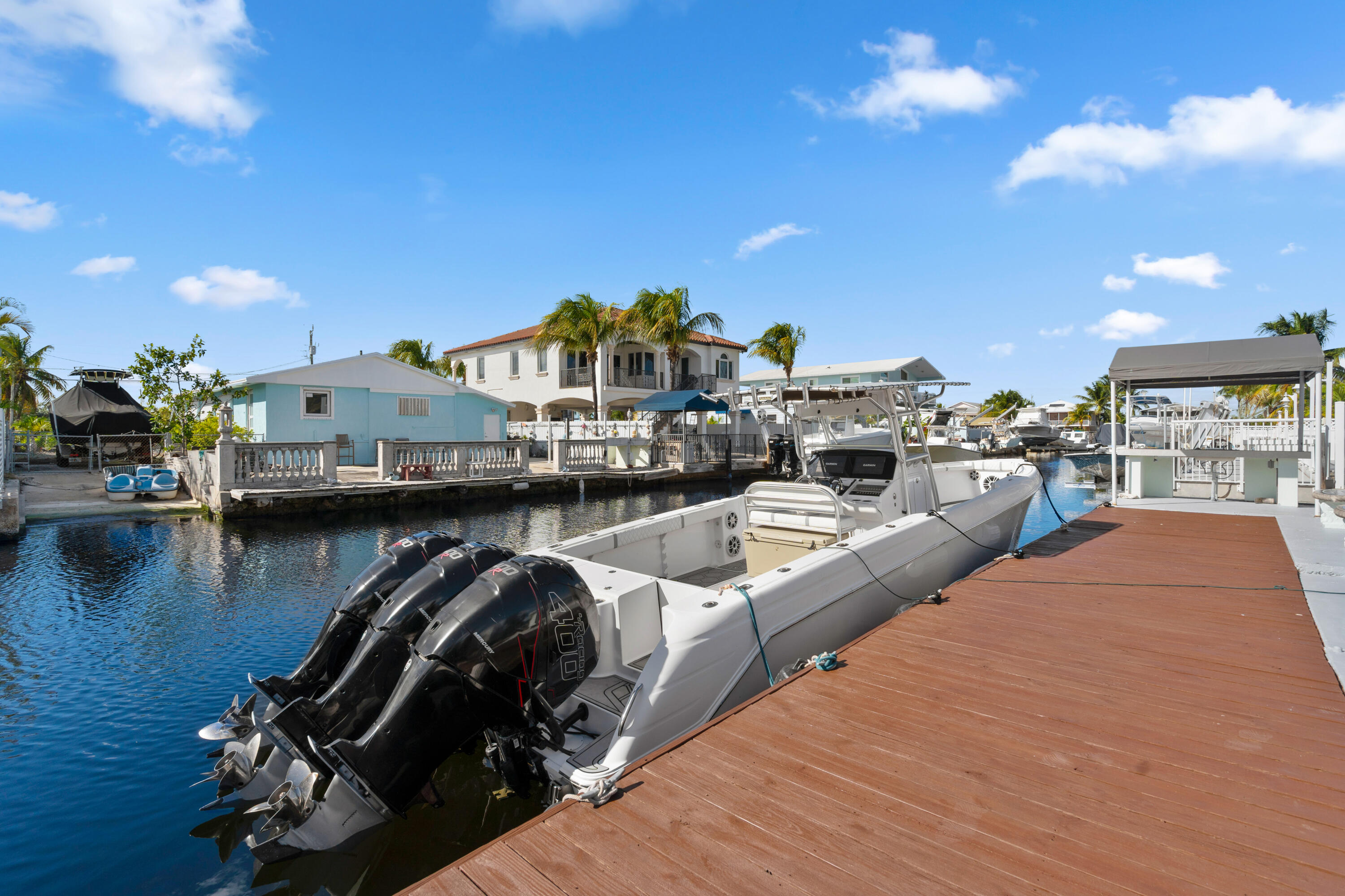 314 Windley Road Key Largo, FL 33037 - Photo 23 of 32 a view of a lake with a house in the background