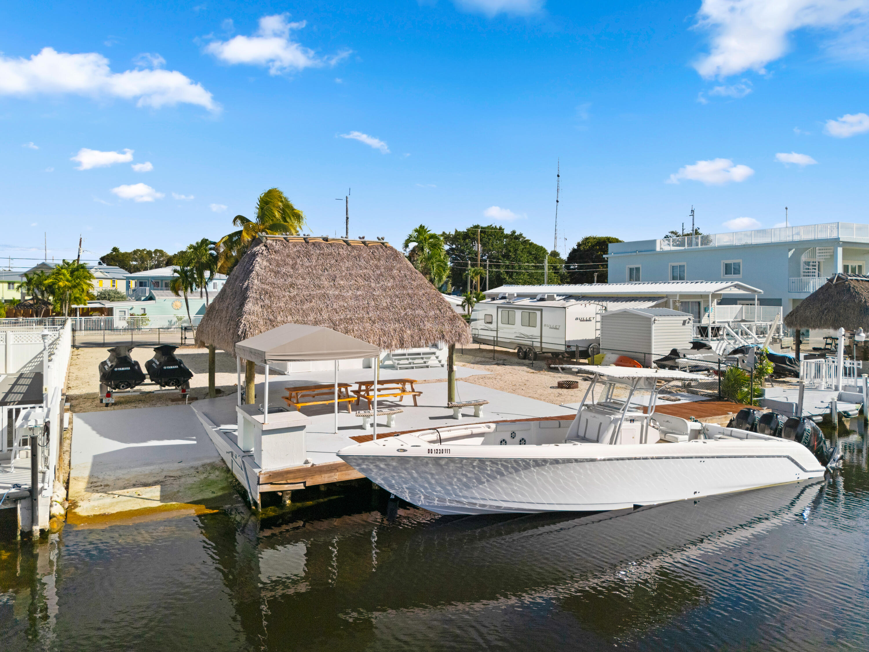 314 Windley Road Key Largo, FL 33037 - Photo 29 of 32 a view of a swimming pool with outdoor seating