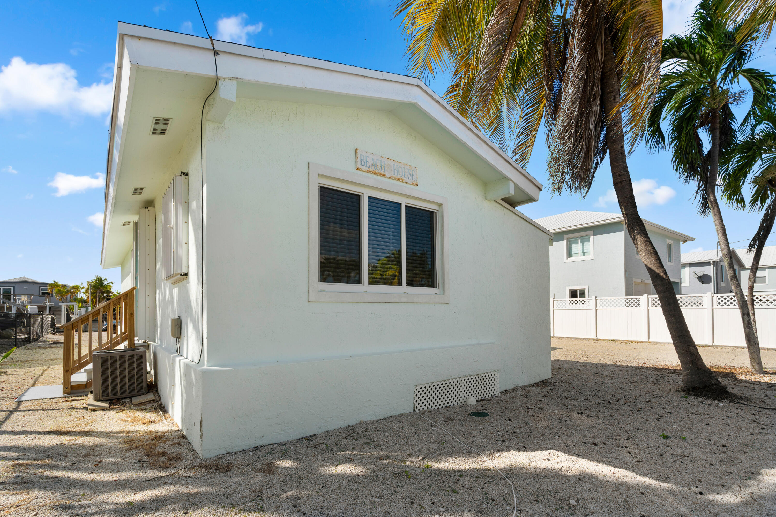 314 Windley Road Key Largo, FL 33037 - Photo 30 of 32 a view of a house with a tree