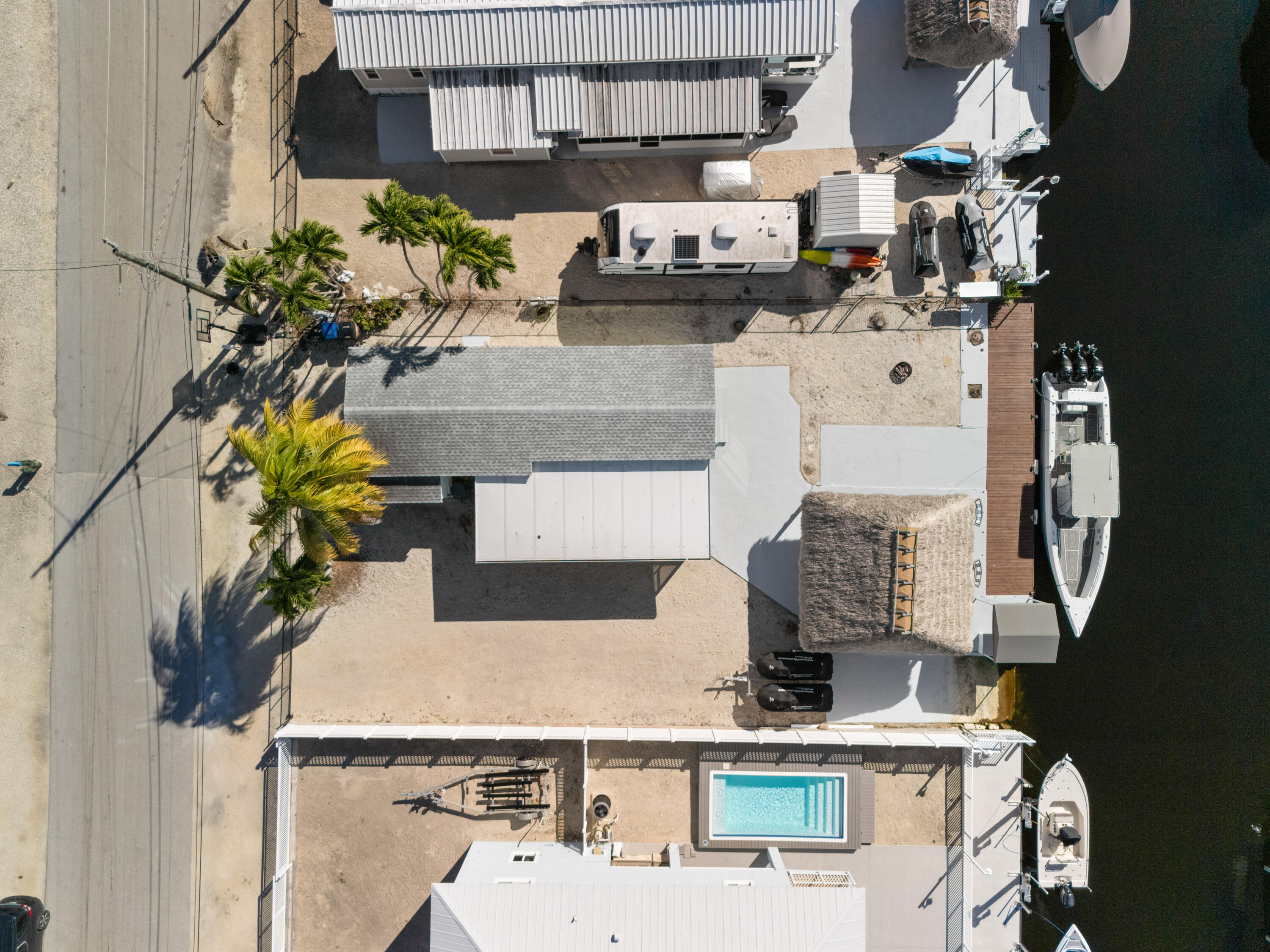 314 Windley Road Key Largo, FL 33037 - Photo 3 of 32 a vase of flowers sitting on a table