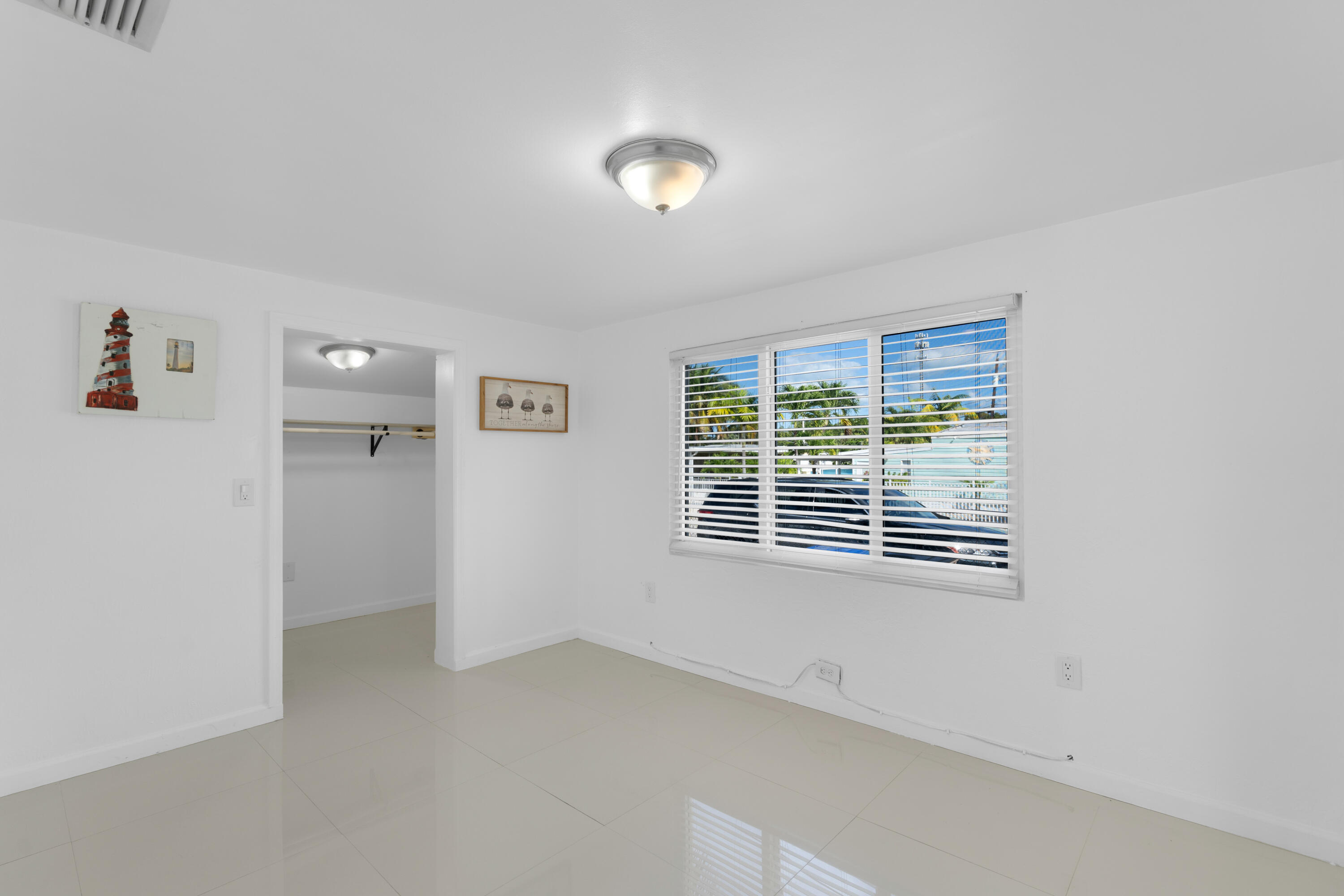 314 Windley Road Key Largo, FL 33037 - Photo 9 of 32 a view of an empty room with a window