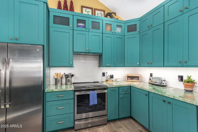 a kitchen with a refrigerator and a sink