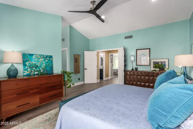 a spacious bathroom with a double vanity sink a mirror and a shower