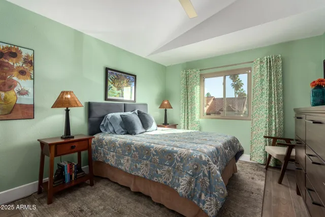 a bedroom with a bed and a dresser