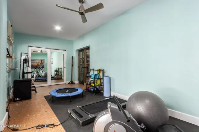 a living room with furniture a flat screen tv and a window