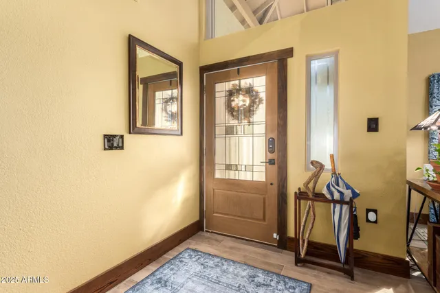 a view of an entryway with wooden floor
