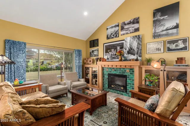a living room with furniture and a fireplace