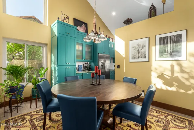 a dining room with furniture and window