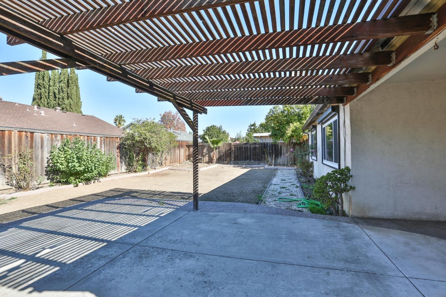261 Bernal Road San Jose, CA 95119 - Photo 17 of 21 a patio with table and chairs