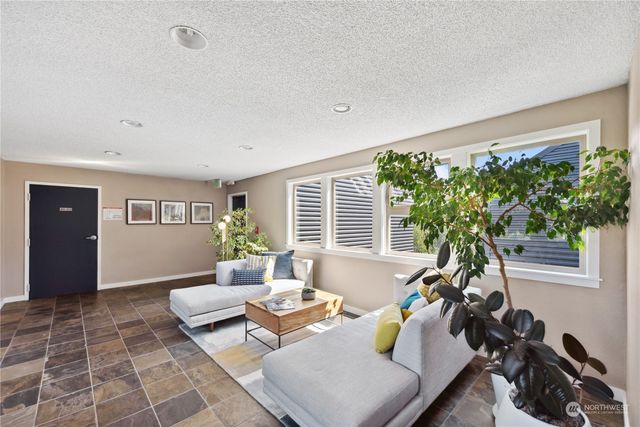 a room with gym equipment and a large window