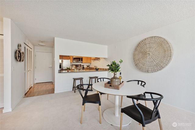 a view of a livingroom with furniture and window