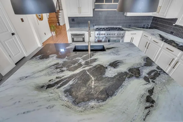 a view of kitchen sink and stove