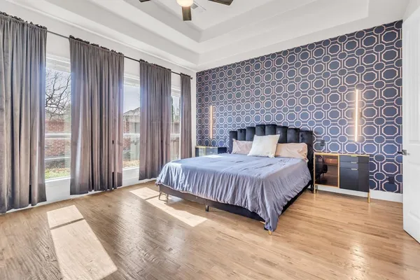a bedroom with a bed and a fireplace