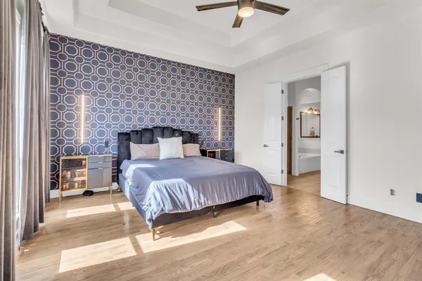 a bedroom with a bed and a fireplace