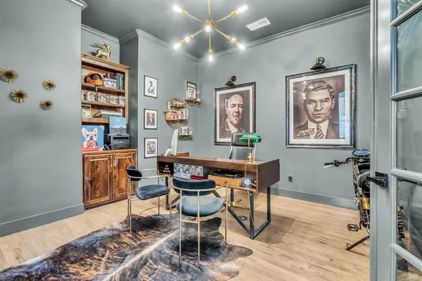 a work room with furniture and wooden floor