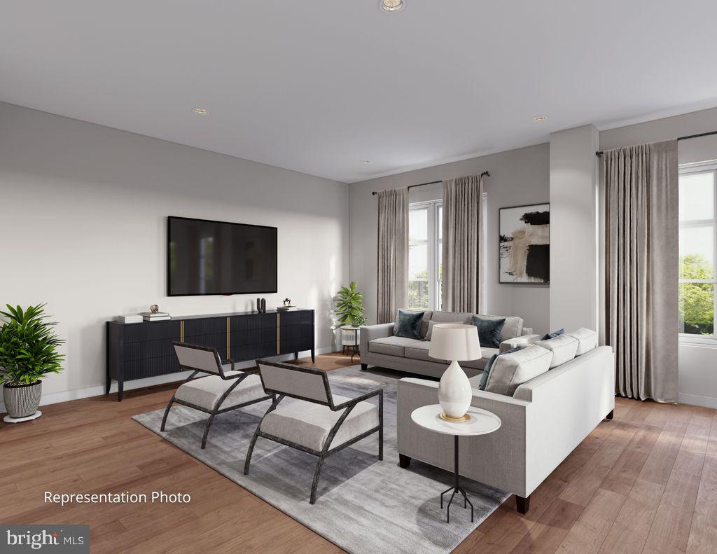 117 Blackford Boulevard, Unit 103 Lebanon, PA 17042 - Photo 4 of 6 a living room with furniture and a flat screen tv