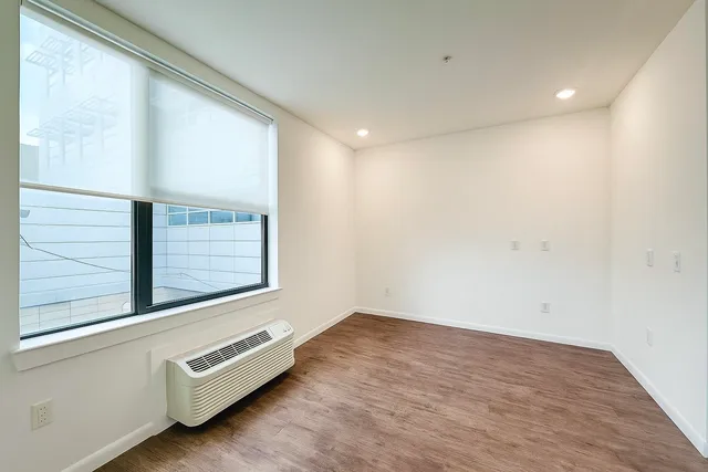 a bathroom with a sink and mirror with toilet
